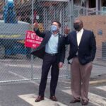 Dan Pratt of TVA and Decosta Jenkins of NES assess bombing damage in Nashville, TN