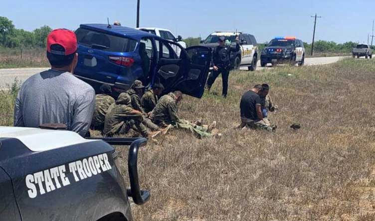 Seven immigrants and an alleged human trafficker apprehended in La Salle County, Texas, April 24, 2021.