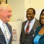Sonny Perdue (left) enjoys a light-hearted moment with TSU President Glenda Glover and Dr. Curtis Johnson